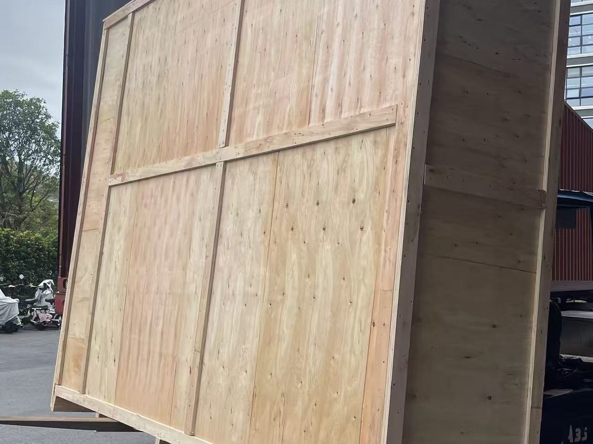 Forklift carrying a wooden crate for shipment