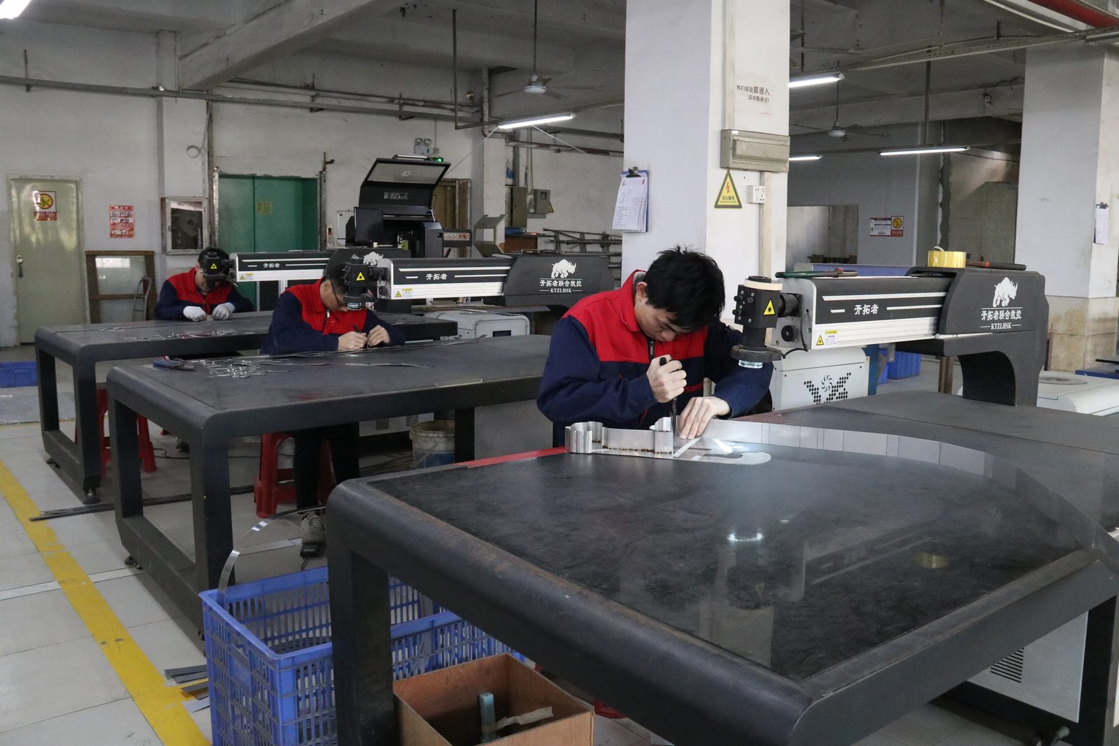 Laser cutting workshop with multiple workstations