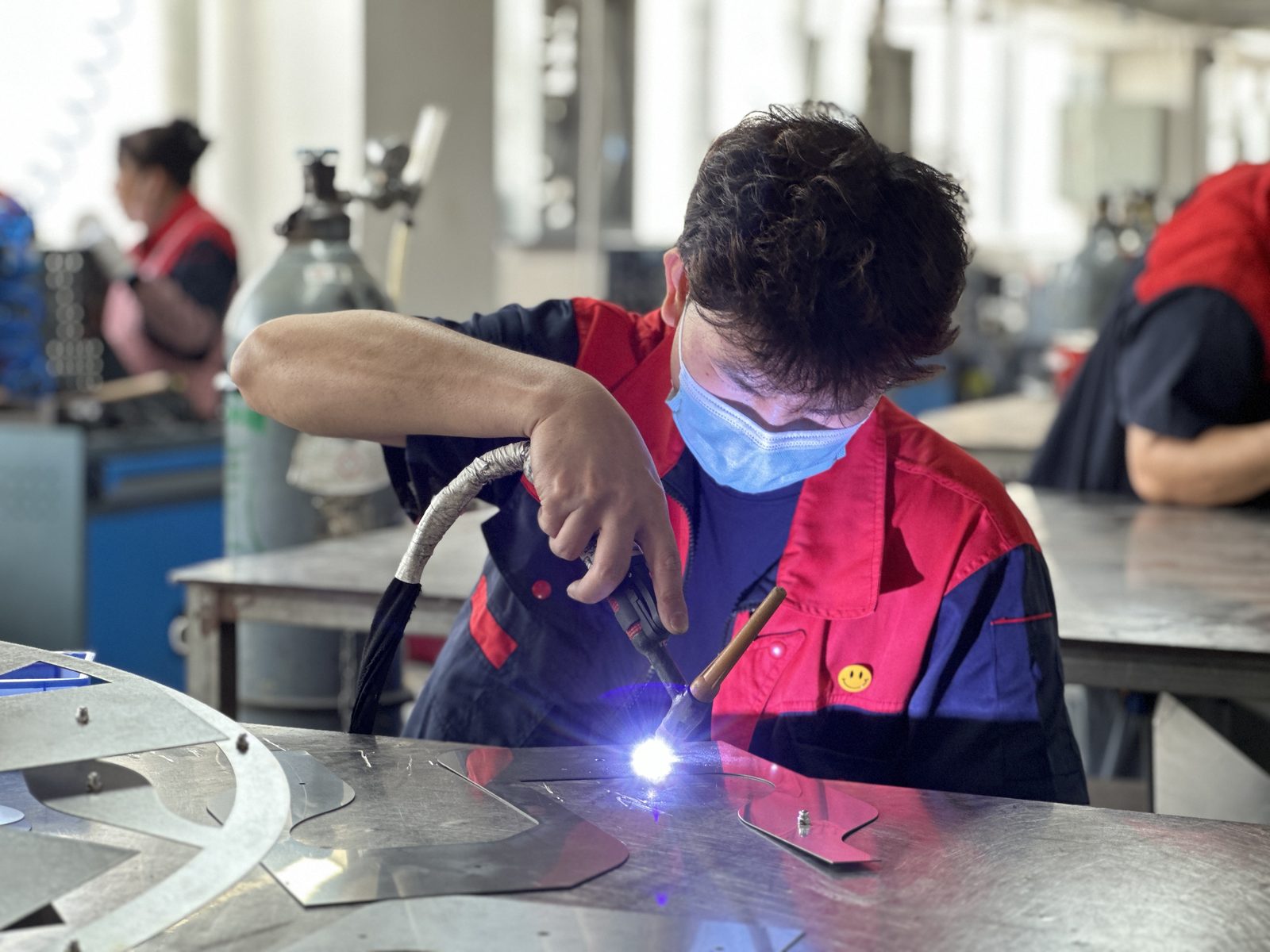 TIG welding a stainless steel sign letter with arc light